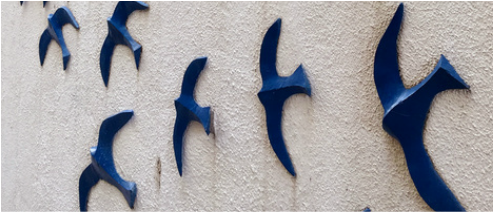 Street art in Sintra. - Bluebirds adorn buildings. - The Fairytale Historic Centre of Sintra, Portugal - www.tilytravels.com