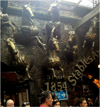 Bronze horses adorning archways in the Stables Market - Camden Market, Camden Town, London - Tily Travels.