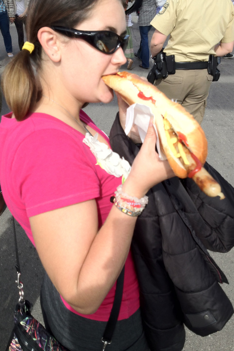 Oktoberfest Munich Photo Diary - Elise eating a bratwurst.