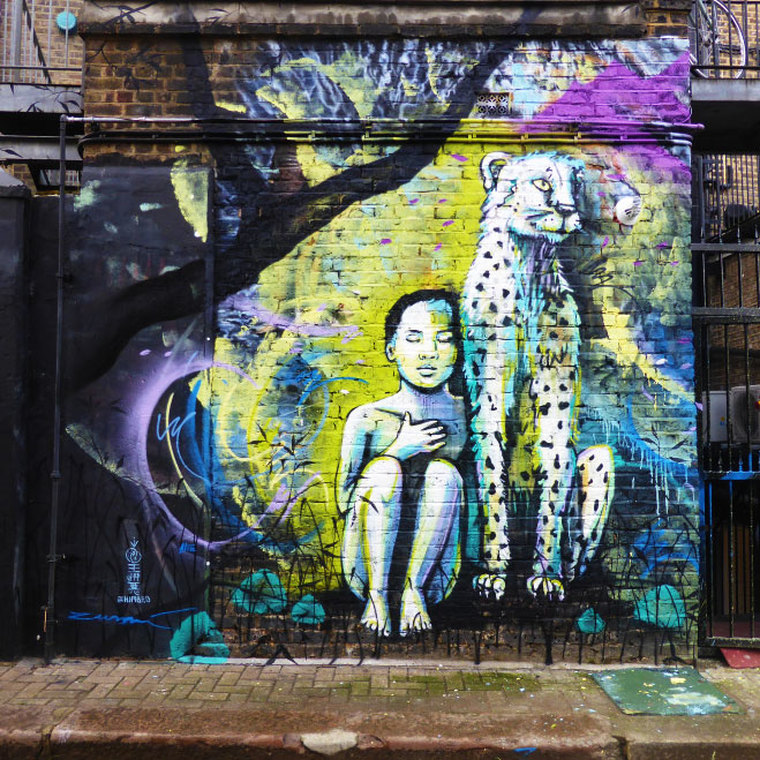 Colab work by Himbad, Alice Pasquini and Marina Zuma - A young girl & cheetah by Alice Pasquini, Hawley Mews, Camden Town - Camden Town Street Art, London England - Tily Travels.