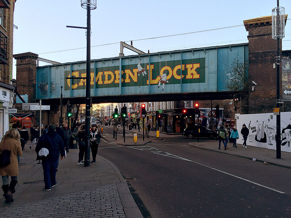 The Camden Lock railway bridge separating Camden High Street from Chalk Farm Road. Also dividing Camden Lock Market from the Stables Market - Camden Market, Camden Town, London - Tily Travels.