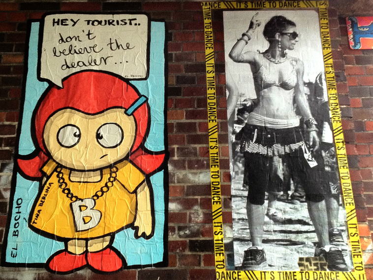 Street Art in Berlin, El Bocho - Travel advice from character Tina Berlina and a paste up of a woman at a music festival.