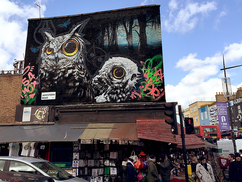 Corner of Jamestown Road & Camden High Street. This large artwork by talented UK artist, Oliver Switch, is positioned high above the street scene and impossible not to notice - Camden Town, London England - Tily Travels.