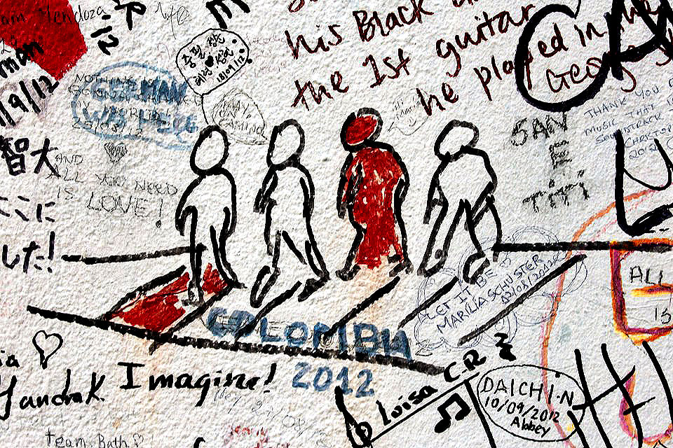 Fan drawn Beatles graffiti drawn on the fence of Abbey Road Studios - Abbey Road Crossing, London, England - Tily Travels.