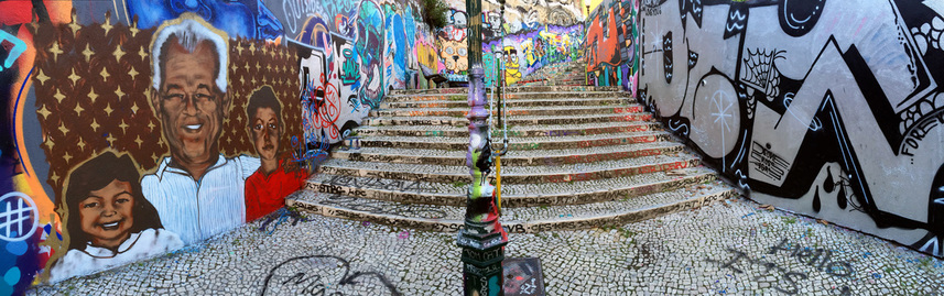 Panorama of the colourful street art and graffiti covering the stairs on Calçada do Lavra, Lisbon, Portugal.