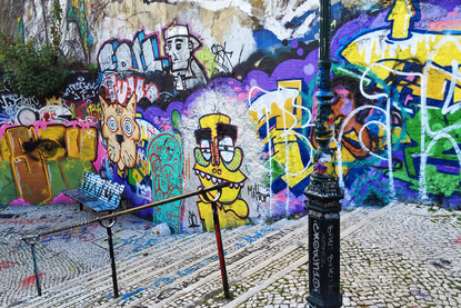 Street art and graffiti covered Calcada do Lavra stairway, Lisbon, Portugal - Calçada do Lavra street art.