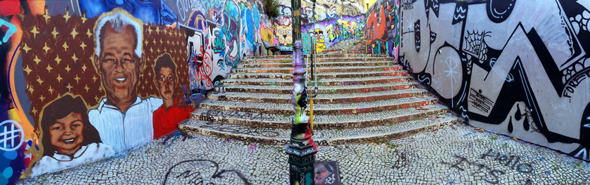 panorama of graffiti covered stairs and alleyway on Calcada do Lavra, Lisbon, Portugal - Calçada do Lavra street art.