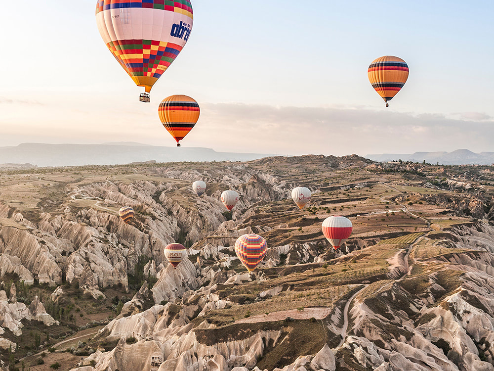 7 Places That Everyone Must Visit in Turkey. Hot air balloons floating over Cappadocia.