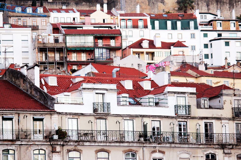 Terracotta tiled homes built on the hills of the Alfama district - Baixa, Lisbon - Portugal.