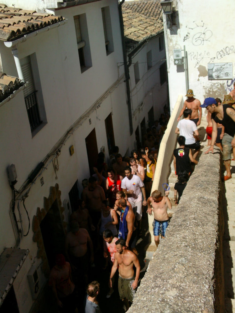 Packed lane ways as people leave the center of old town, Bunol. La Tomatina 2012