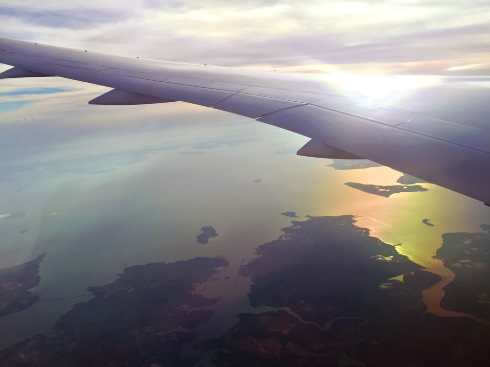 Flying over Batam, Indonesia at sunset - Jetstar Melbourne to Singapore Flight JQ 007.