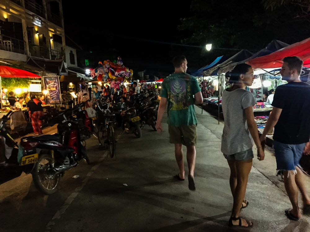 Walking through the night market. Sisavangvong Road, Luang Prabang, Laos.