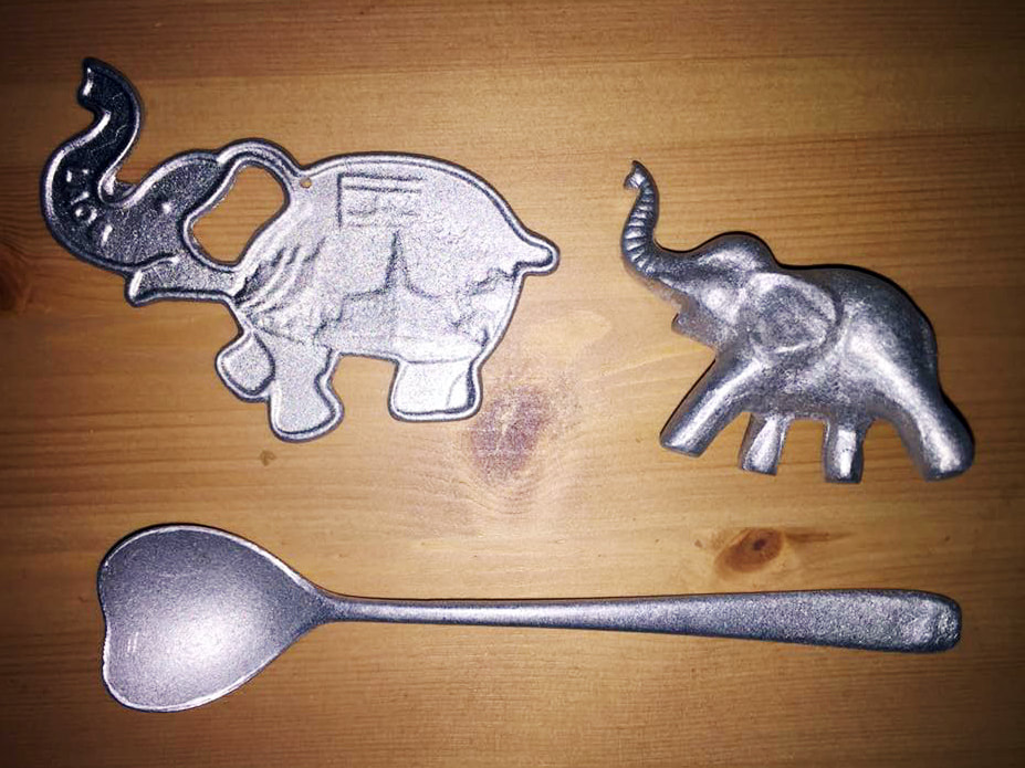 The recycled items purchased though the peaceBOMB project by Article 22. A bottle opener, spoon and elephant trinket. Night Market, Luang Prabang, Laos.