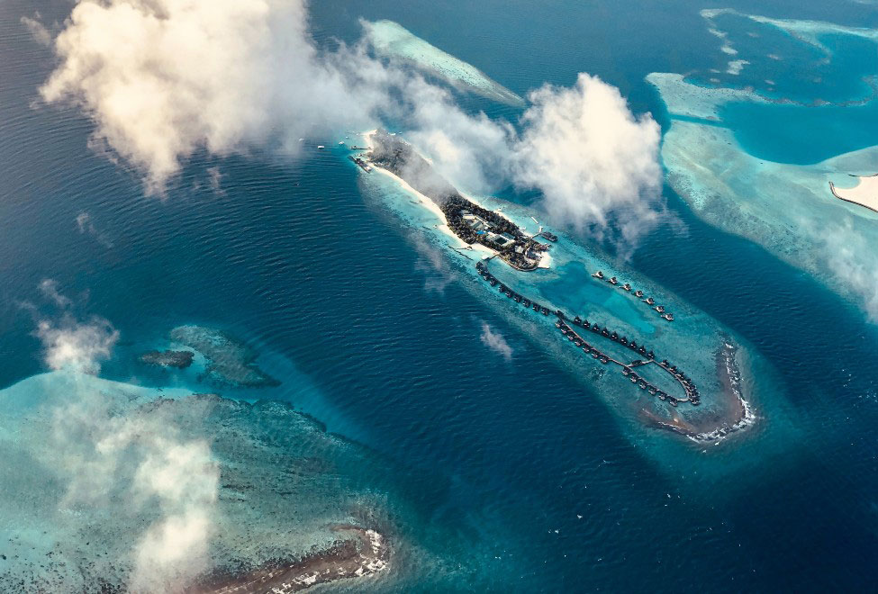 Laamu Atoll: The Perfect Setting for the Luxury Honeymoon of your Dreams // Aerial image of the Maldives from a seaplane. 