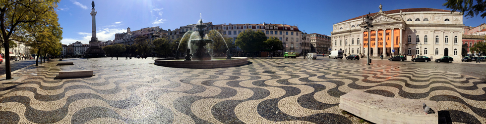 Panorama of Pedro IV/ Rossio Square, Lisbon, Portugal - Pattern pavement, the Column of Pedro IV, a broze fountain and the National Theatre D.Maria II (Teatro Nacional D.Maria II).