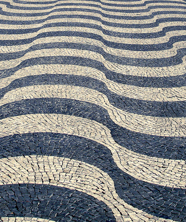 Portuguese pattern pavement in Pedro IV/ Rossio Square, Lisbon, Portugal