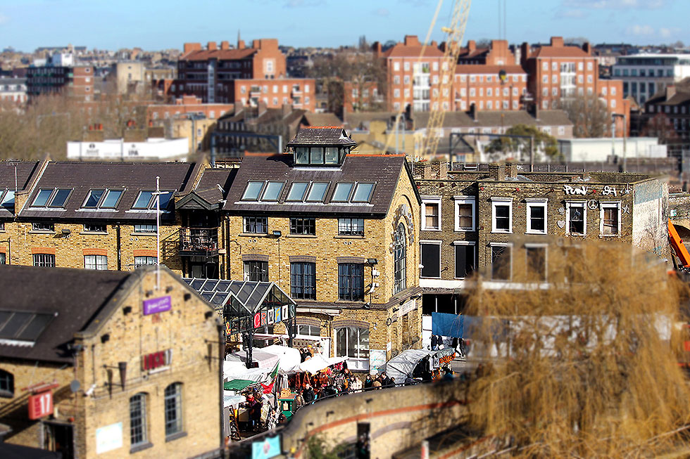 A tilt-shift image of the Camden Lock Market and the old facade of the Camden Lock Village - Camden Town, London England - Tily Travels.