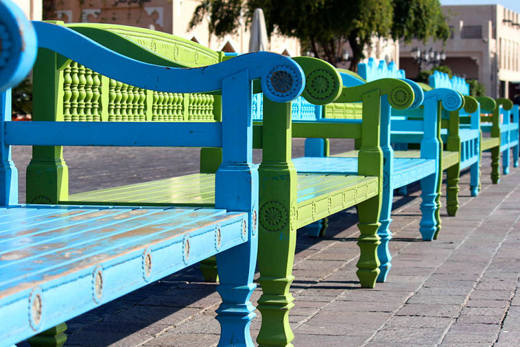 Qatar Airways free Doha city tour - Colourful benches inside Katara Cultural Village.