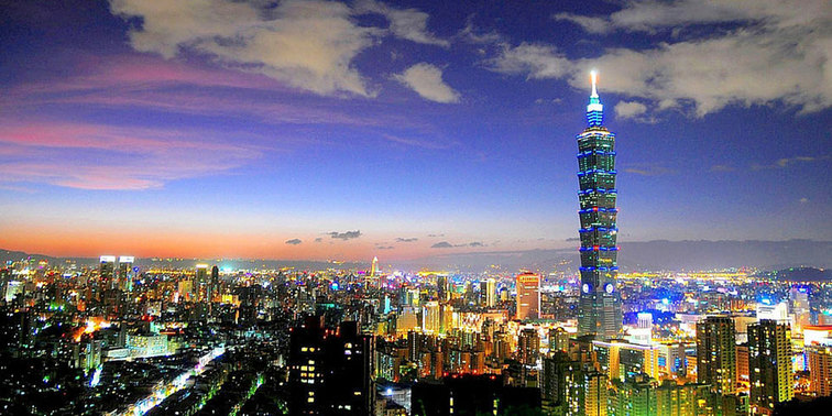 International Airport's with Free Layover Transit Tours - Taoyuan International Airport, Taipei, Taiwan - Arial view of Taipei, Taiwan at night.