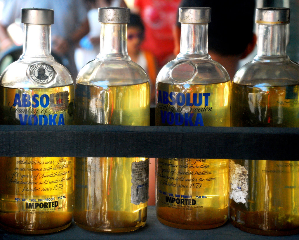 Misadventure in Kuta: Methanol Poisoning. Absolute Vodka bottles filled with petrol. Photo by Pranav Seth.