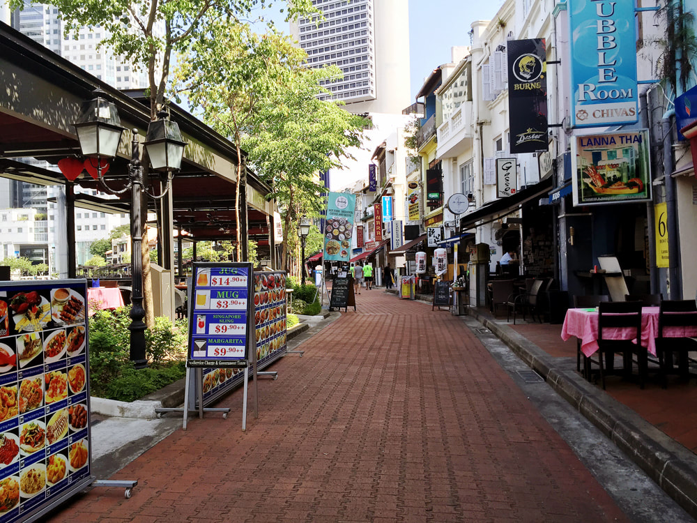 The restaurants, bars and shops lining the Boat Quay Esplanade.