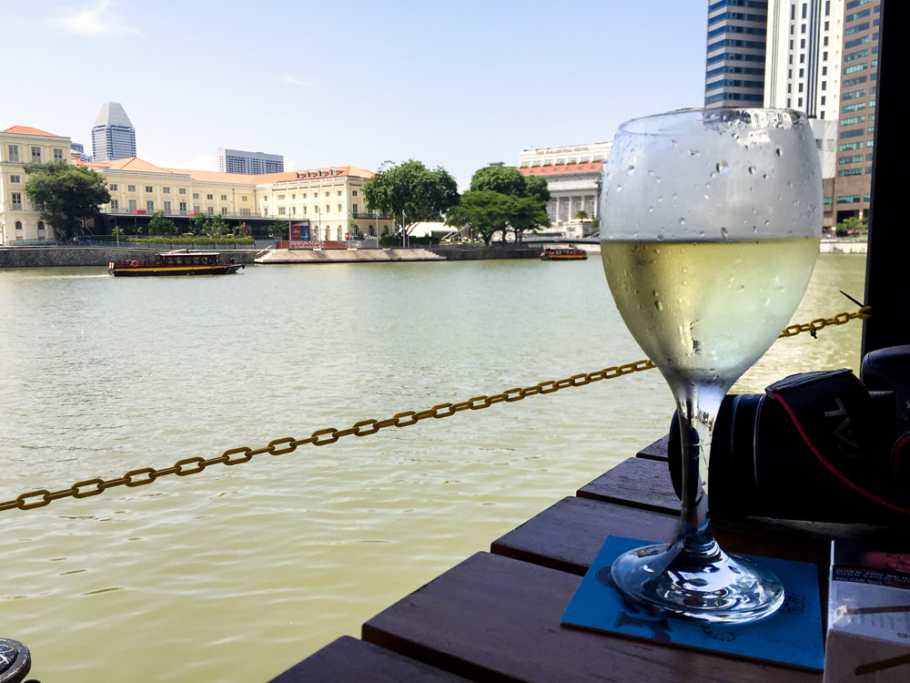 Enjoying a drink along the Singapore River in Boat Quay.
