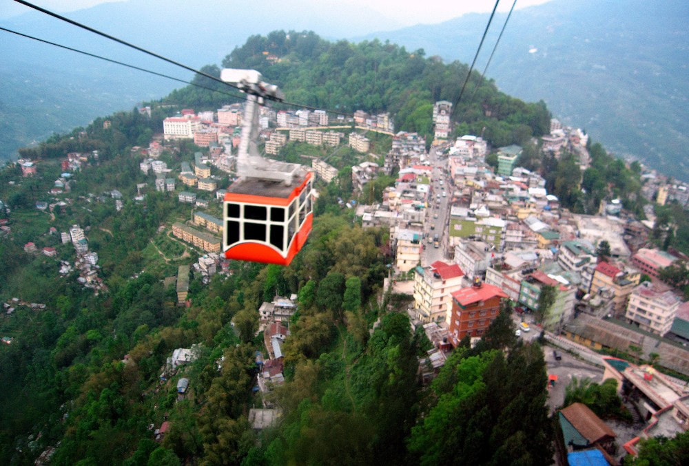 Experience Monsoon Like Never Before With Your Sweetheart At These Honeymoon Destinations in India - Chair lift over Gangtok, India.