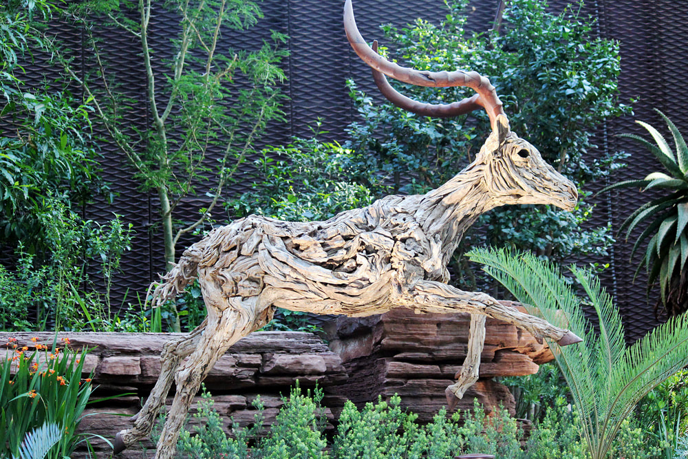 Wooden reindeer by Sculptor James Doran inside the Flower Dome at Gardens by the Bay, Singapore