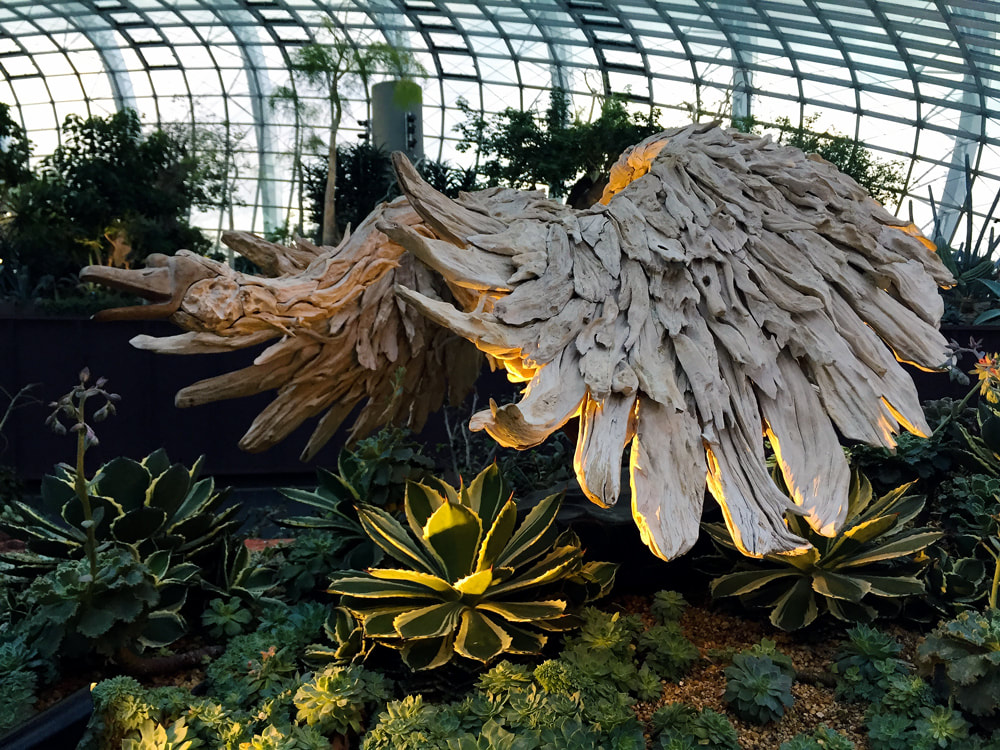 Wooden wings by Sculptor James Doran inside the Flower Dome at Gardens by the Bay, Singapore