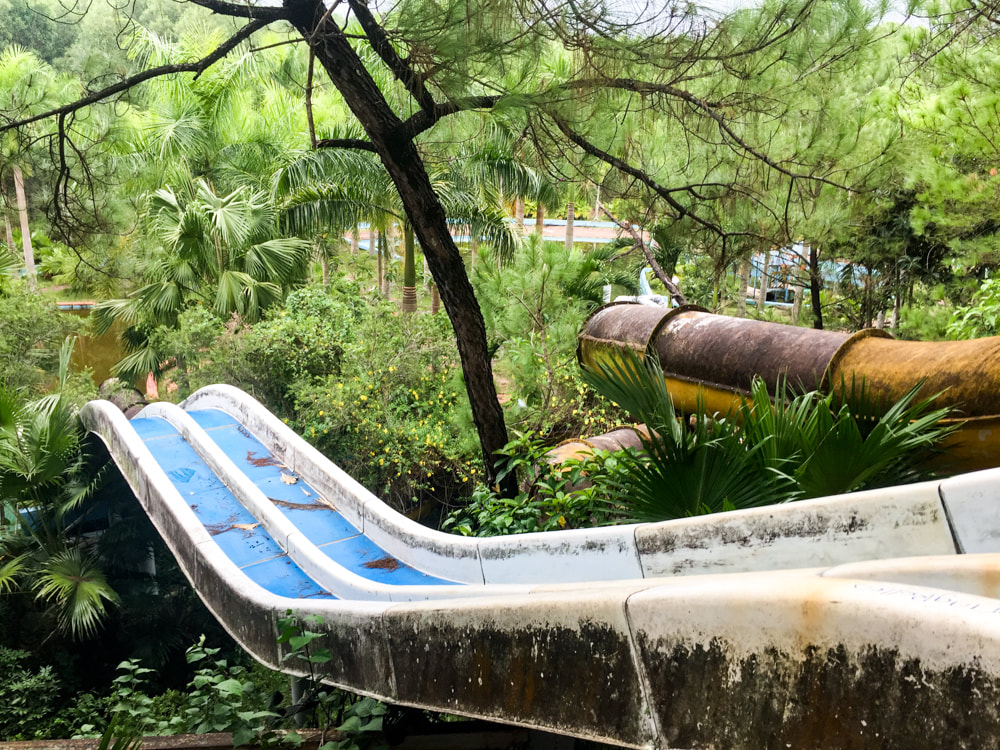 A view from upstairs of 2 of the water slides // Hue: Ho Thuy Tien, Photos of Vietnam's Abandoned Water Park.