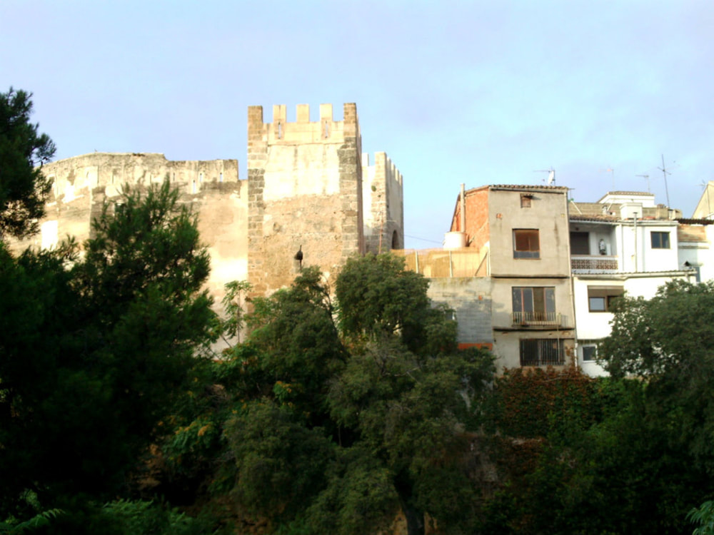 Houses built right alongside Bunol Castle (Castle of Buñol). La Tomatina 2012