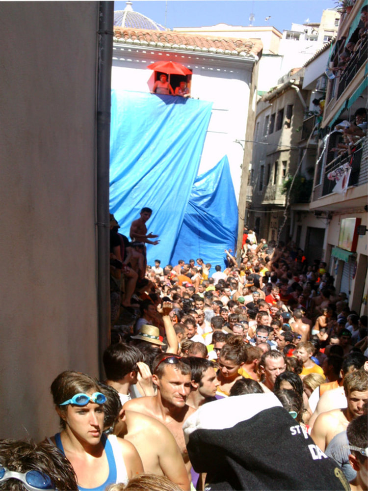 Festival goers exiting the square on a shower search. La Tomatina 2012