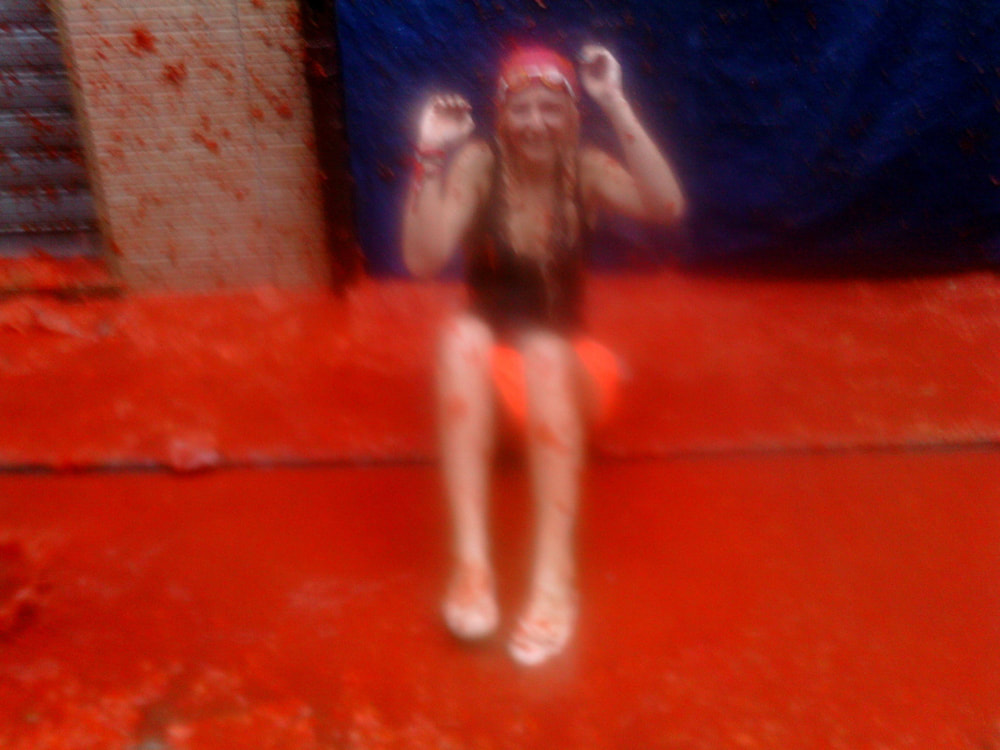 Sitting in tomatoes. After the tomato fight - La Tomatina 2013