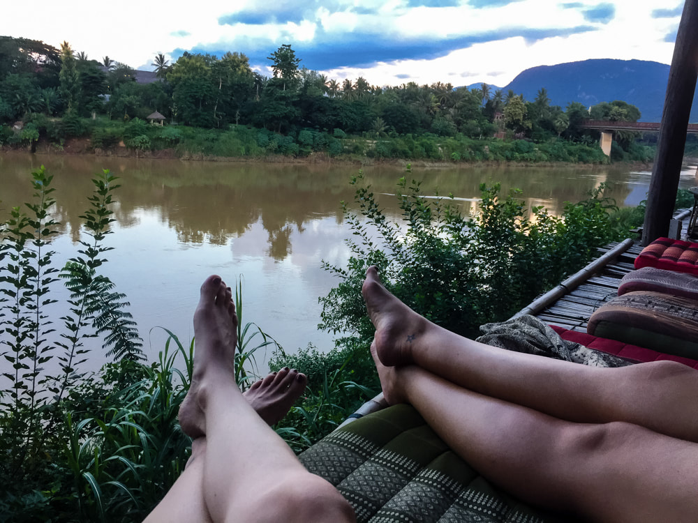 Laying on the decking at Utopia, Luang Prabang, Laos.