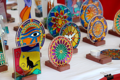 Close up of colourful Stained glass/ Lead-light pendants at the Praca do Comercio handicraft market, Lisbon, Portugal.