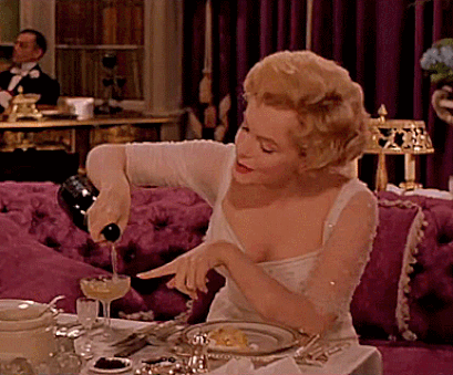 Marilyn Monroe pouring champagne