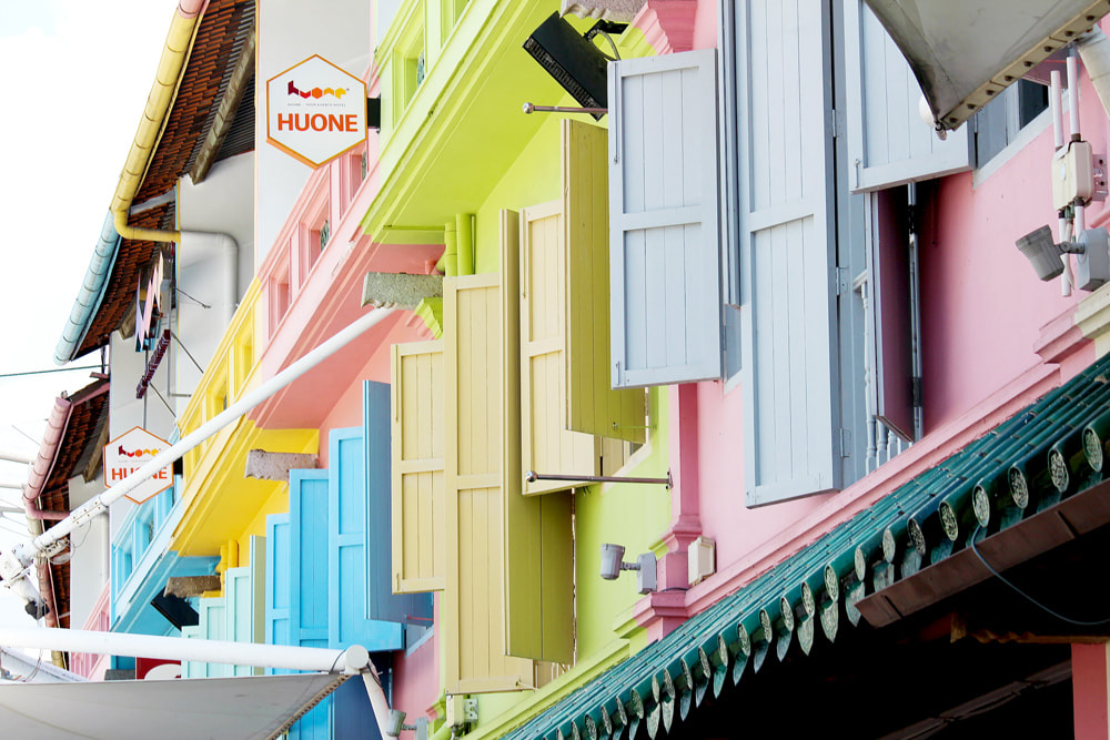 Colourful shutters adorning the businesses on Clarke Quay Esplanade, Singapore.