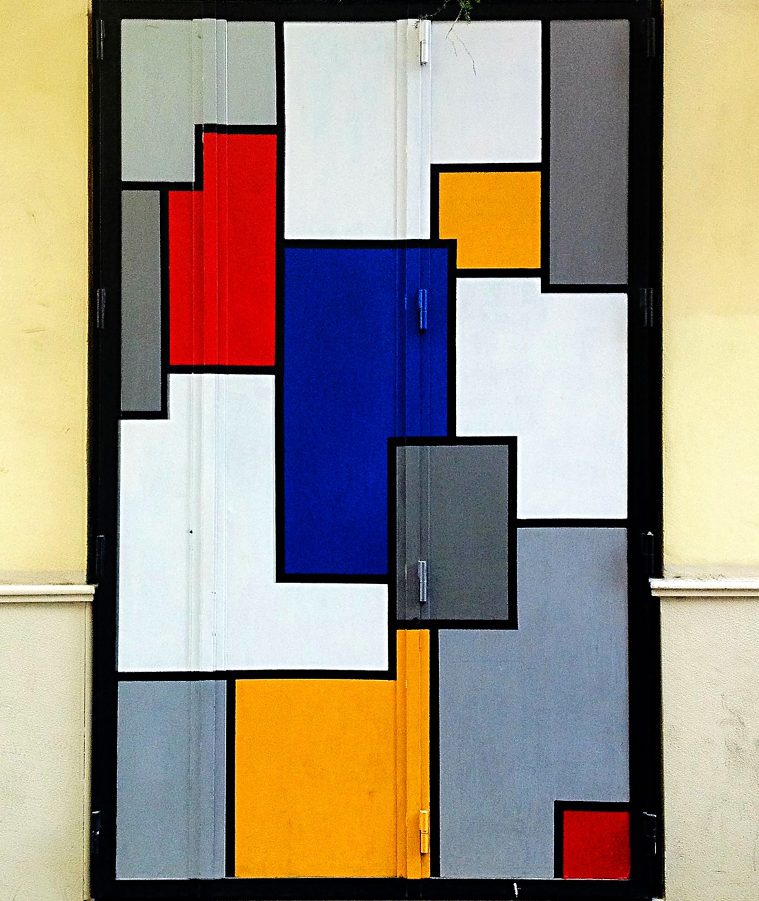 Street Art in El Carmen, Valencia, Spain - An adaption of the Composition series by Piet Mondrian painted on a window.